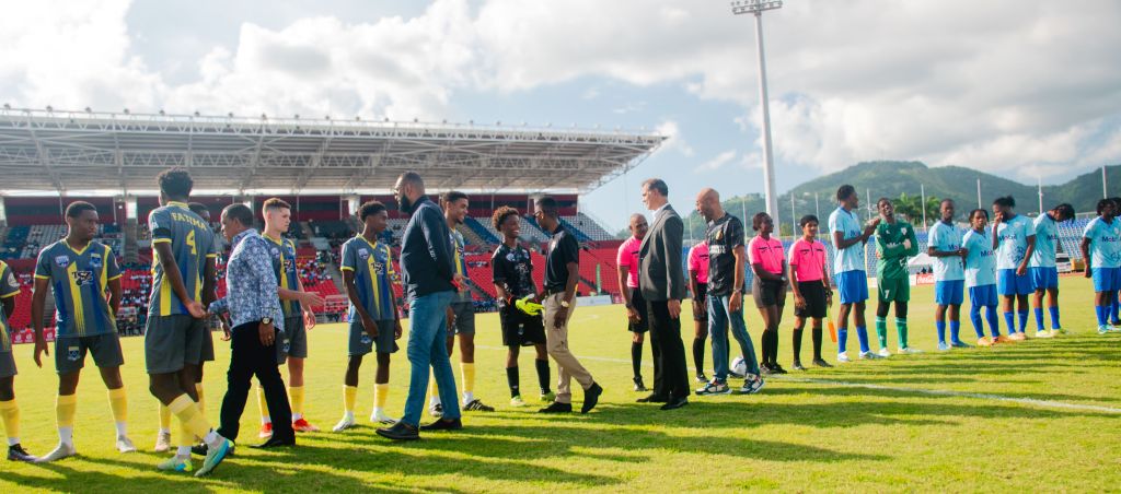 Game Officials greeting the teams before the start of the game