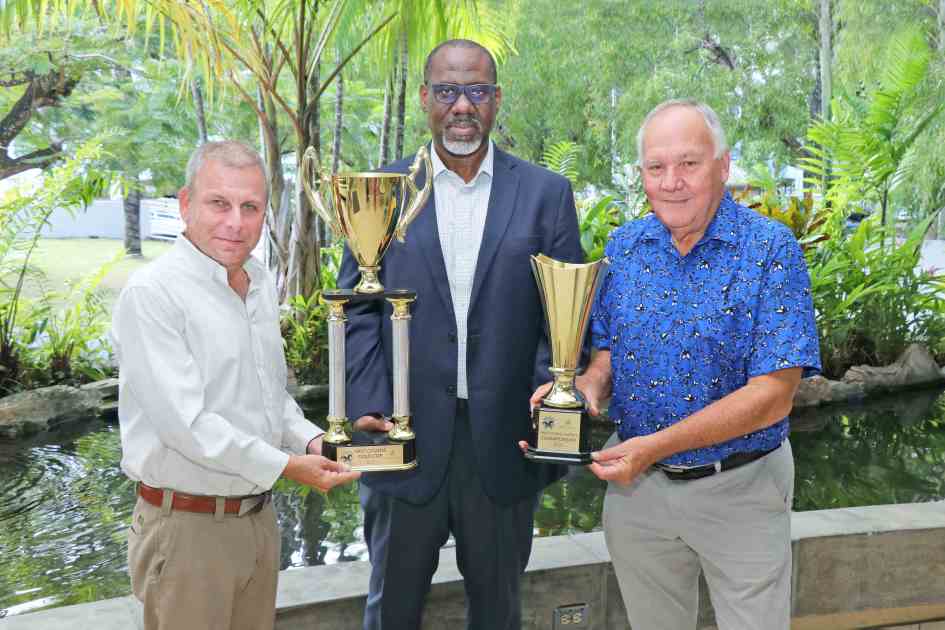 (l-r) Roger Hadeed – Member, Arima Race Club, Carver Trim - General Manager – Trustee Services, First Citizens and John O’Brien – Management Committee Member, Arima Race Club show the Boxing Day trophies for the First Citizens Gold Cup and First Citizens Juvenile Championship